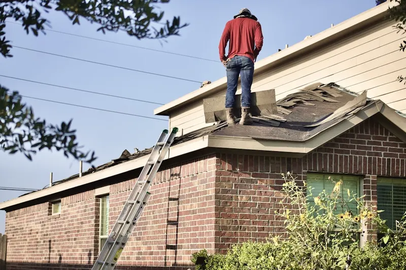 Professional roofer working on a residential roof in Misty Pines